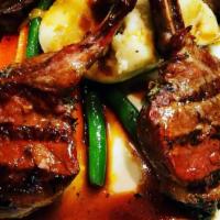 Lamb Chops · Marinated and grilled lamb chops in a Barolo red wine and shallot reduction sauce.