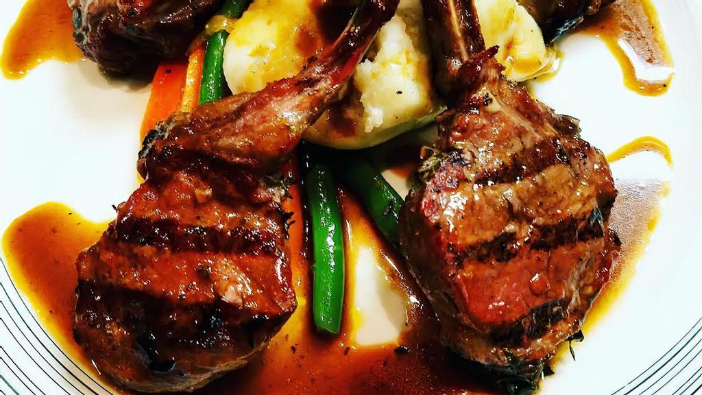 Lamb Chops · Marinated and grilled lamb chops in a Barolo red wine and shallot reduction sauce.