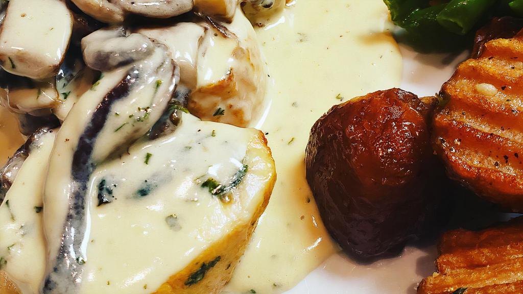 Chicken Rollatini · Pounded and stuffed chicken breast, prosciutto, spinach, Fontina cheese, in a creamy mushroom sauce.