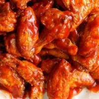 Buffalo Wings · Served with blue cheese or ranch dressing, and celery sticks.