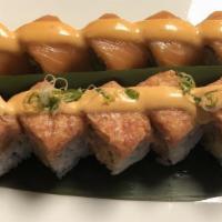 Mama Mia Roll · Inside: salmon tempura, asparagus Outside: fresh salmon with spicy mayo