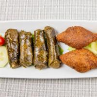 Stuffed Grape Leaves · Stuffed grape leaves with ground meat, rice, and spices.