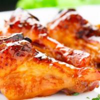 Honey Hot Wings · Honey Hot wings made to delight. Comes with celery and bleu cheese.