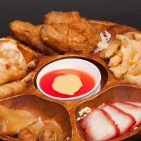 Combination Platter · Egg rolls, prawns, dumplings, BBQ pork, tempura vegetables and chicken wings.