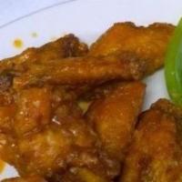 Boneless Buffalo Tenders · Spicy buffalo tenders served with celery and blue cheese.