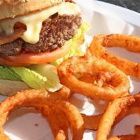 Philly Burger · Hamburger seasoned and stuffed with Cheddar and bacon, with lettuce, tomato and onion. Consu...