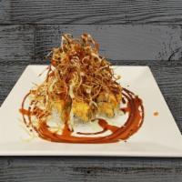Volcano Maki · California maki with baked spicy sea scallops topped with crunch.