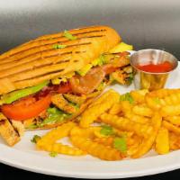 Chicken Sandwich · Pan-seared chicken served with bacon, lettuce, tomato, onions, mayonnaise, avocado, and Fren...