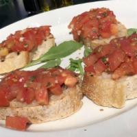 Bruschetta · Seasoned diced and fresh tomatoes, basil, and olive oil on homemade organic bread.