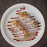 Small Cannoli  (2 Pc) · Authentic Sicilian Cannoli filled with Ricotta cream and sprinkled with crushed Pistacchio .