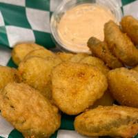 Fried Pickles · Battered pickle slices, deep fried to perfection. Comes with a side of Ranch or Giovanni Sau...