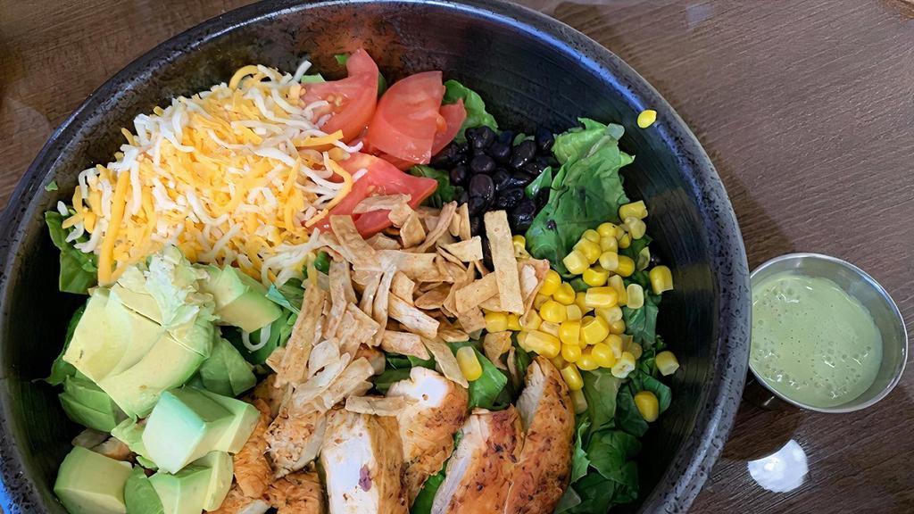 Southwest Salad  · Grilled chicken breast, black beans, tomato, grilled corn, avocado,
shredded cheese, chives, tortilla chips. Served with a lime wedge
and cilantro lime cream dressing