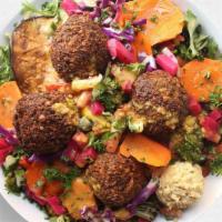 Summer Salad · mixed greens, falafel, lebanese tabbouleh, classic hummus, eggplant, lemon mint carrots, pic...