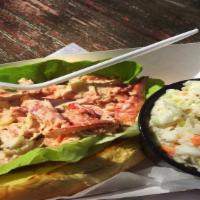 Lobster Roll Sandwich · Whole Maine lobster meat lightly tossed in a perfectly seasoned dressing, nestled in a bed o...
