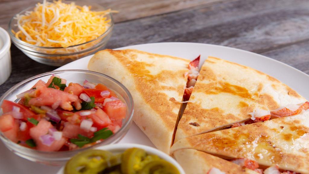 Lobster Quesadilla · Our quesadillas are like no other, stuffed with whole Maine lobster meat, Mexican cheese and pico de gallo and served with a side of sour cream.