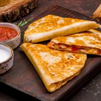 Crispy Chicken Quesadilla · Great option for the “Land Lover” in the crowd, stuffed with crispy chicken breast meat, Mex...