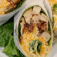 Chicken Bacon Wrap · Our fire braised chicken breast wrapped in a soft tortilla shell with crispy bacon, shaved C...