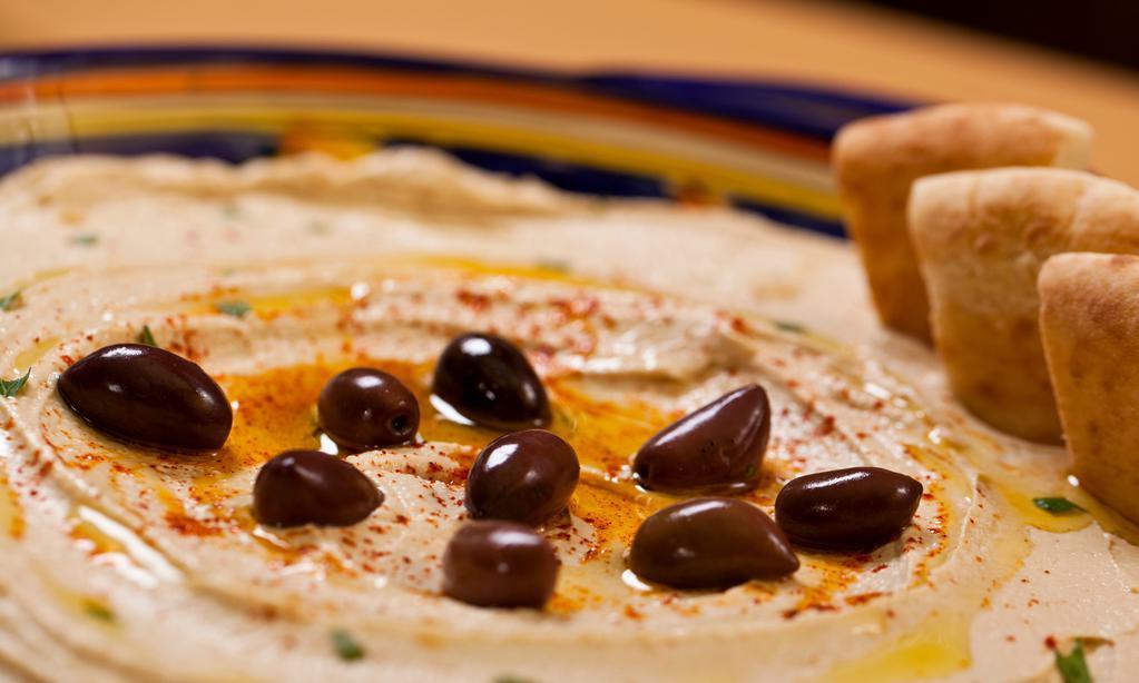 Hummus · Vegan. Our signature recipe of puréed chickpeas, tahini, lemon, and garlic.