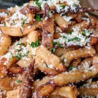 Truffle Fries · House cut fries, parmesan cheese, white truffle oil, served with side ketchup