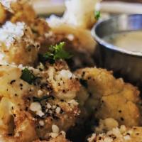 Fried Cauliflower · Fresh cauliflower fried and tossed with parmesan chess , garlic and seasonings, served with ...
