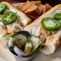 Grilled Chicken Banh Mi · Lemongrass marinated chicken thigh, cucumber, fresh cilantro, Asian slaw, sweet chili, toppe...