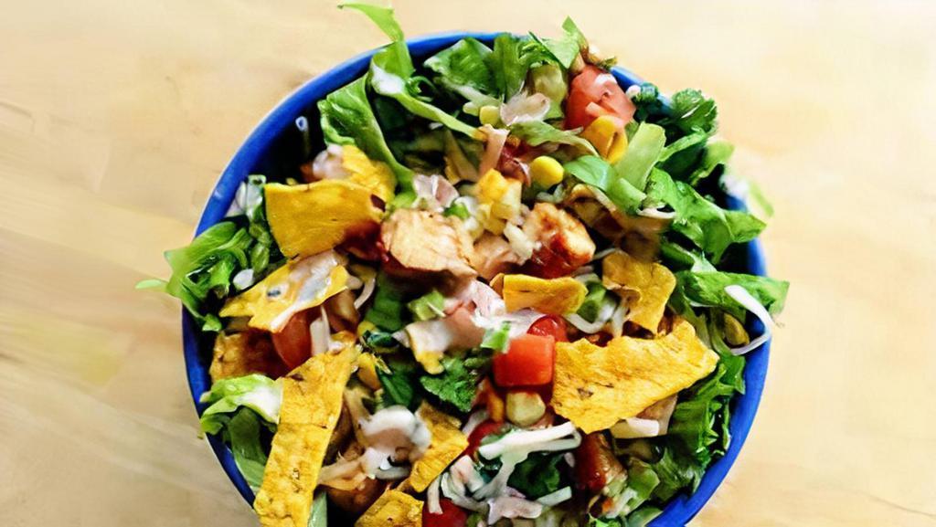 Taco Salad · Taco seasoned chicken, cheese, red onions, tomatoes, black beans, sour cream, avocado slices, salsa, chips.