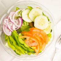 Garden Salad · Cucumbers, red onions, tomato, green peppers, kalamata olives, and hard-boiled egg.