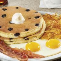 Blueberry Pancake Breakfast. · Juicy blueberries cooked inside two buttermilk pancakes. Served with two eggs and hash brown...
