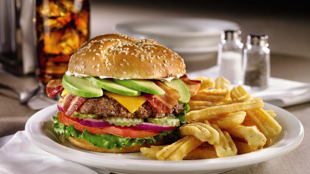 Bacon Avacado Burger · Hand pressed beef patty with bacon, fresh avocado, Cheddar cheese, mayo, lettuce, tomato, red onion, and pickles on a brioche bun. Served with wavy fries.