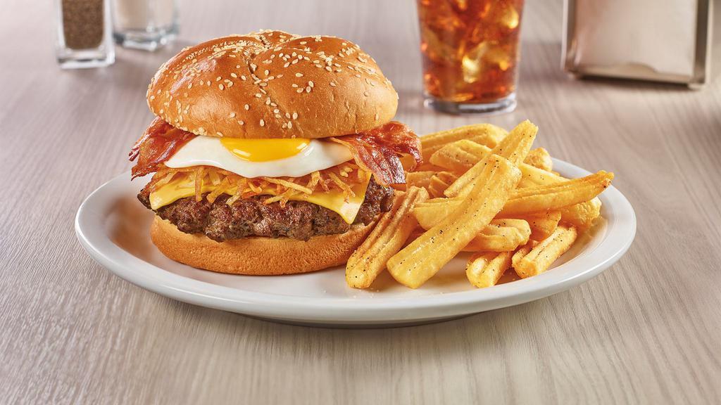 Slam Burger · Hand pressed beef patty, with hash browns, an egg, bacon, and American cheese on a brioche bun. Served with wavy cut fries.