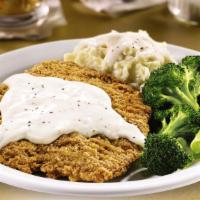 Small Country-Fried Steak. · Chopped beef steak smothered in country gravy. Served with two sides and dinner bread.