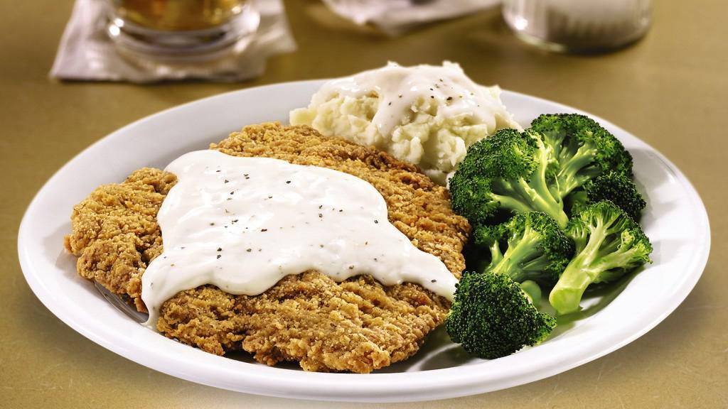 Large Country Fried Steak · A large chopped steak smothered in country gravy and choice of two sides. Served with dinner bread