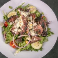 Black N’ Bleu Salad · Sliced steak tips topped with melted crumbled bleu cheese, served on a garden salad.