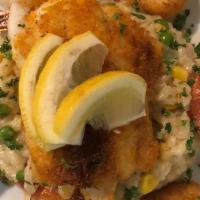 Seafood Casserole · Scallops, shrimp and haddock topped with a sherry Ritz cracker topping. Served with one side.