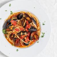 Oceano Mussels · Red or white over linguini.