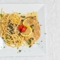 Veal Picatta · Lemon wine sauce with capers, served with spaghetti.