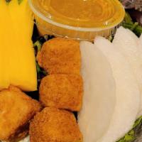 Asian Pear And Mango Salad · Asian pear, mango, crunch tofu with greens and ginger dressing