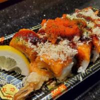 Rock N Roll · Shrimp tempura, cucumber on top spicy tuna, crunch, and tobiko.