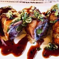 Cowboy Maki · Asparagus, tempura, red onion and enoki mushroom covered with broiled sirloin steak and avoc...