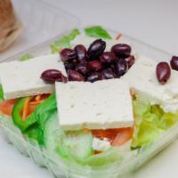 Greek Salad · Garden salad topped Feta, Anchovies & Olives.