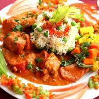 Chicken Tikka Masala · Most popular Indian entrée! Tender pieces of boneless chicken breast marinated and grilled i...
