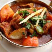 Kadai Chicken · Tender pieces of boneless chicken breasts cooked in tangy tomato sauce with bell peppers and...