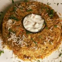 Vegetable Biryani · An exotic blend of basmati rice, assorted vegetables, and traditional spices and herbs.