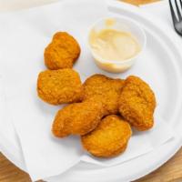 Chicken Nuggets · Served with honey mustard or BBQ sauce.