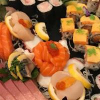Doma Roll · Inside assorted sashimi, mango, avocado, spicy sprout, tobiko, wrapped with thinly sliced cu...