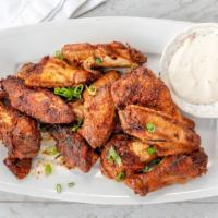 Grilled Chicken Wings · 10 grilled and flavorful chicken wings served with cilantro and blue cheese dressing.