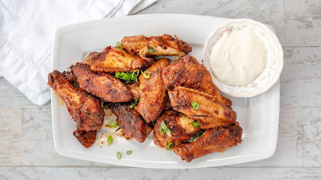 Grilled Chicken Wings · 10 grilled and flavorful chicken wings served with cilantro and blue cheese dressing.