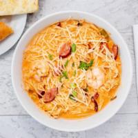 Angel Hair Pasta Dinner · Top menu item. Smoked sausage, shrimp, and chicken tossed around in our secret house sauce, ...