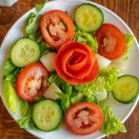 Green Salad · An assortment of lettuce, cucumber, onion, tomatoes, green pepper and chickpeas served with ...
