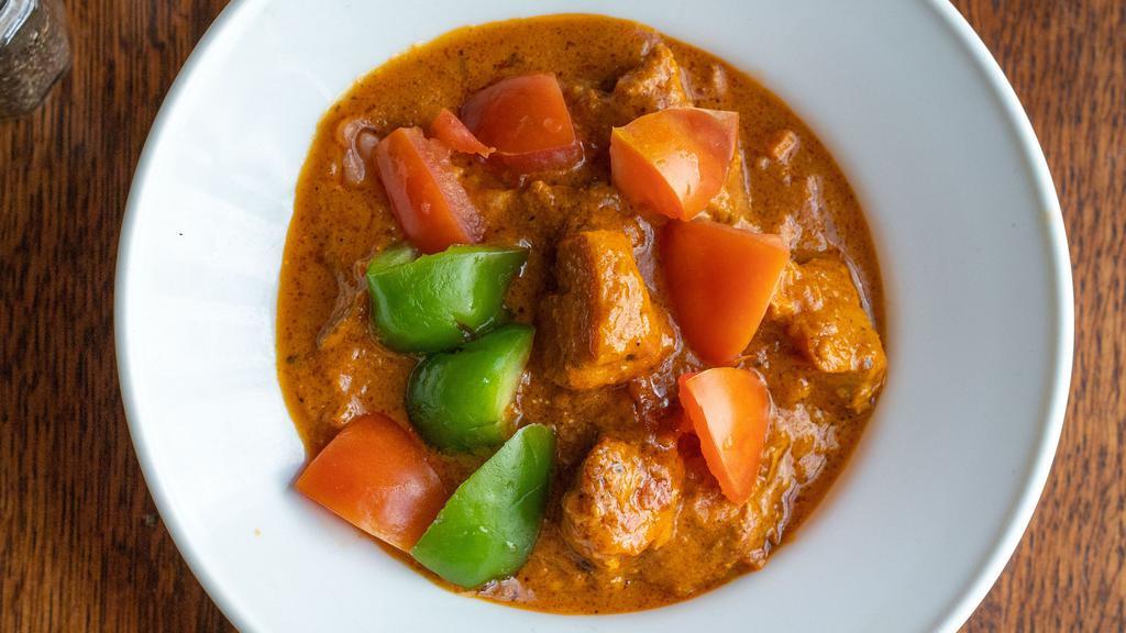 Chicken Tikka Masala · A delicious preparation of tandoori chicken tikka cooked in an almond creamy sauce with onion and green peppers.